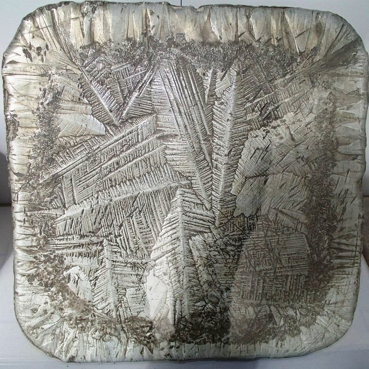 Antimony regulus with star-pattern crystalline surface